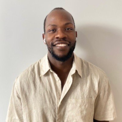 A man wearing resene grain brown short sleeved shirt